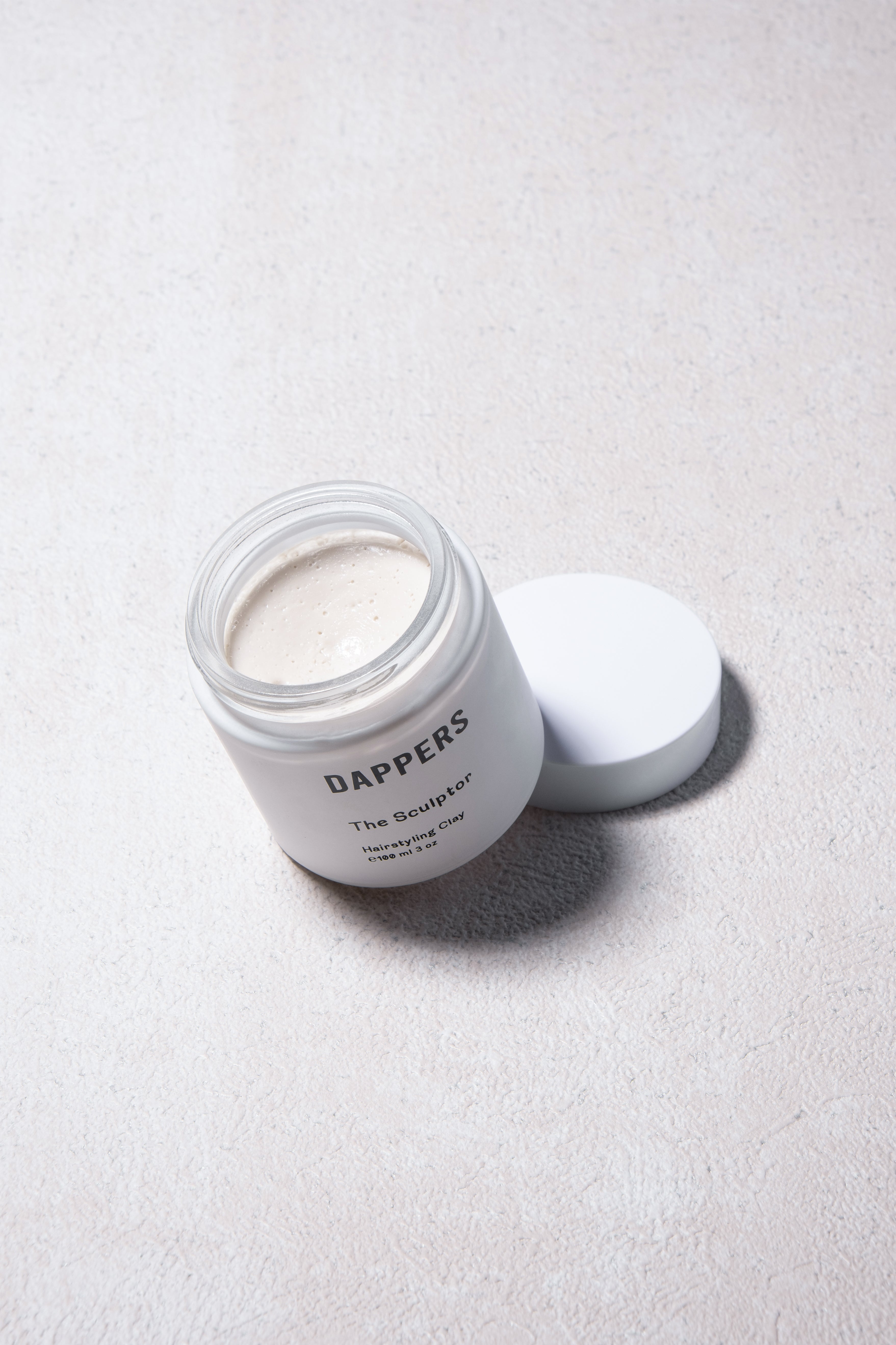 The Sculptor Haistyling Clay